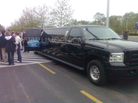 Limo Chicago 14 passenger Ford Excursion with American Idol insignia on the open door