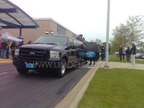 14 passenger Ford Excursion in front of reception building