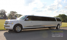 14 passenger limo Lincoln Navigator with sun glare