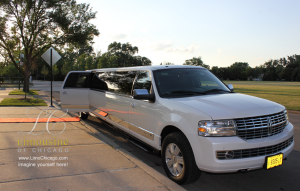 14 passenger limo with red carpet near church