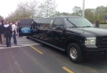 Limo Chicago 14 passenger Ford Excursion with American Idol insignia on the open door