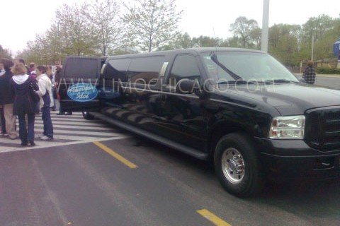 Limo Chicago 14 passenger Ford Excursion with American Idol insignia on the open door