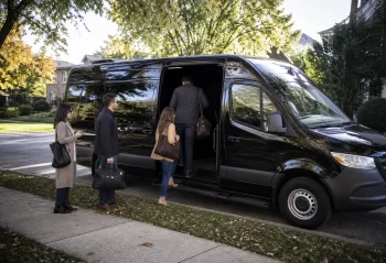 Suburban group boarding a black executive van for a Chicago event